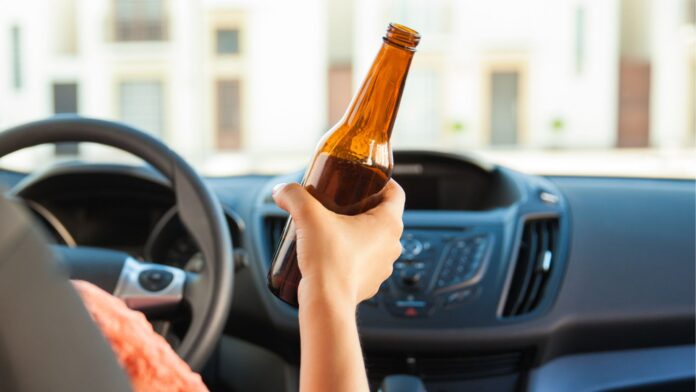 Woman drinking and driving Woman drinking and driving