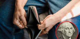 Man Looking at an Empty Wallet