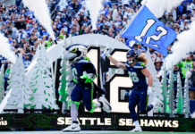 NFL 2026 arrancará en Seattle con el juego inaugural de los Seahawks Blitz, la mascota de los Seahawks, y el ala cerrada Brady Russell (38) saltan al campo antes del partido contra los Rams de Los Ángeles, el domingo 3 de noviembre de 2024 en Seattle. (Foto AP/Ben VanHouten)