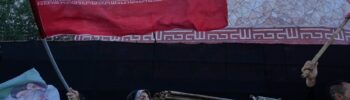 Una mujer pasa junto a un mural antiestadounidense en la pared de la antigua embajada de Estados Unidos, ahora convertida en museo, en Teherán, Irán, el viernes 12 de junio de 2026. (Foto AP/Vahid Salemi)