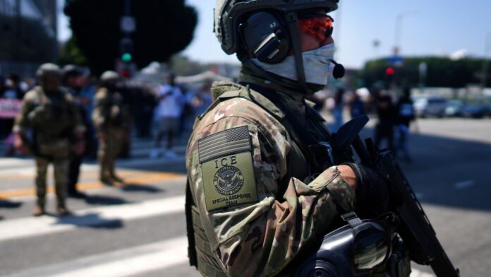 ICE Agent with weapon