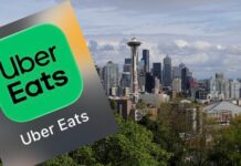Uber Eats pagará casi $4.4 millones a más de 14,000 trabajadores en Seattle Logotipo de Uber Eats sobre una imagen panorámica de Seattle con la Space Needle y edificios del centro de la ciudad.
