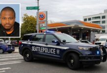 Arrestan en Chicago a sospechoso de tiroteo mortal cerca del Space Needle Patrulla de la Policía de Seattle frente a la gasolinera 76 donde ocurrió el homicidio , con una fotografía insertada de Michael Oneal Fleming, sospechoso del tiroteo mortal cerca del Space Needle.